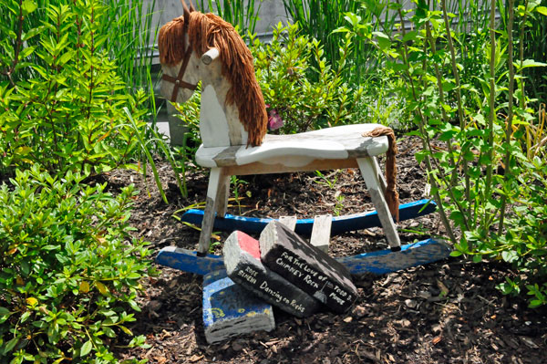 painted rock books and a toy pony